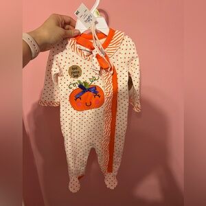 Girly pumpkin footie onesie with bow